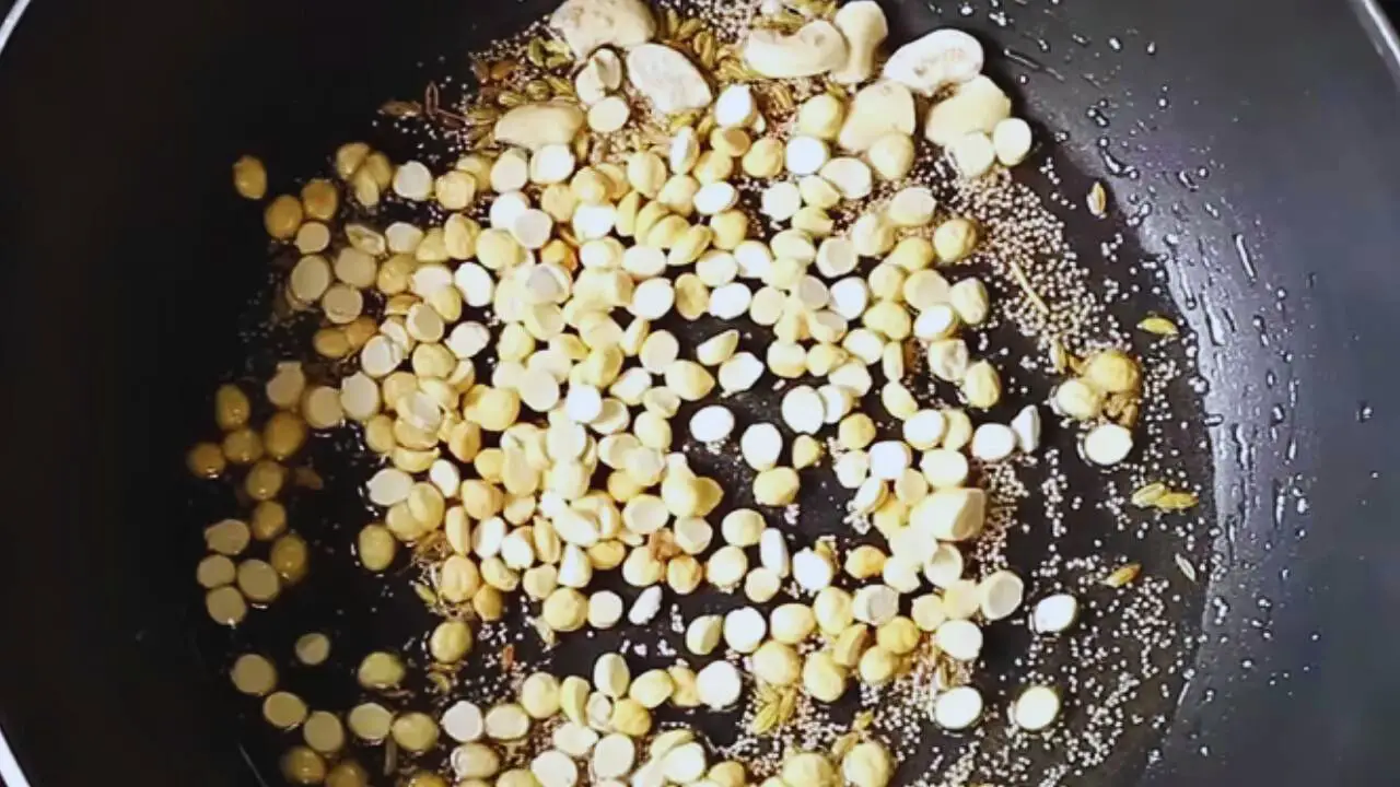 Adding chana dal to the ingredients 