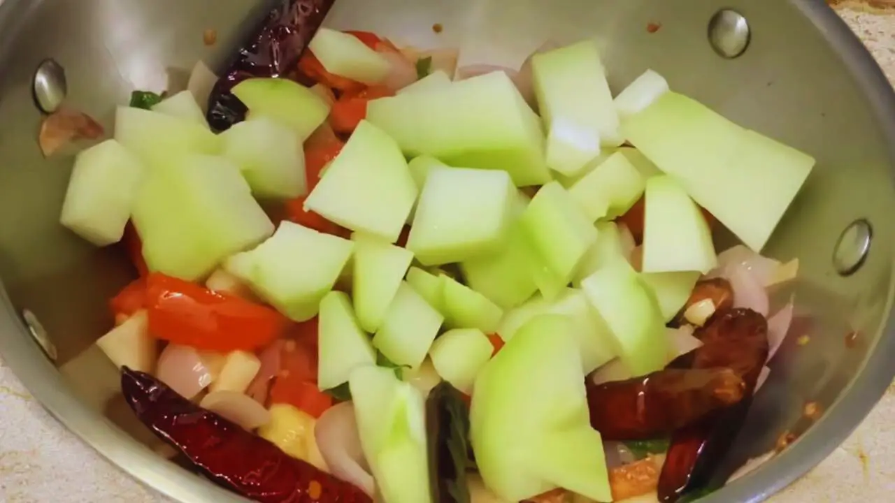 Adding chow chow to the chutney ingredients 