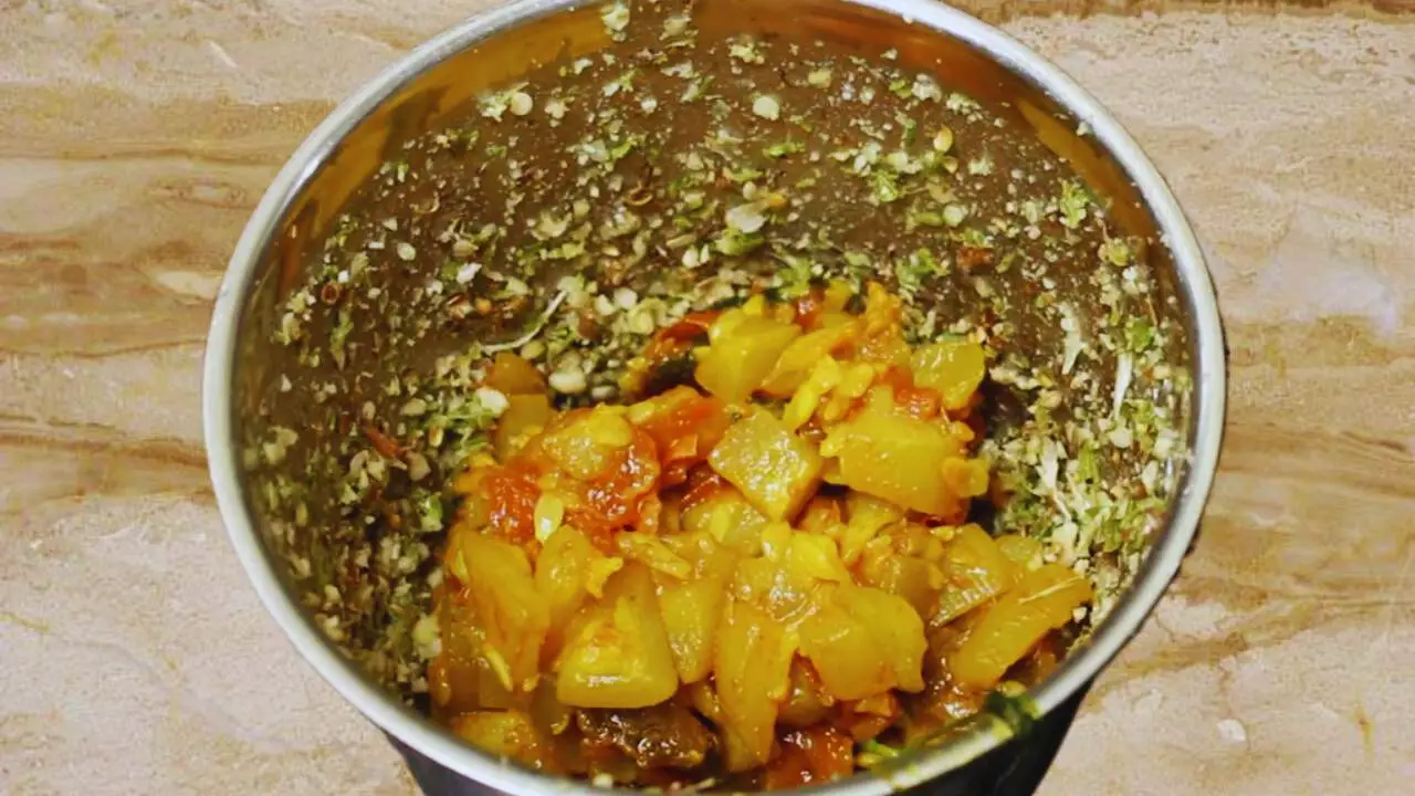 Adding cooked bottle gourd 