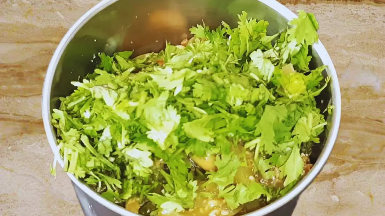 Adding coriander leaves