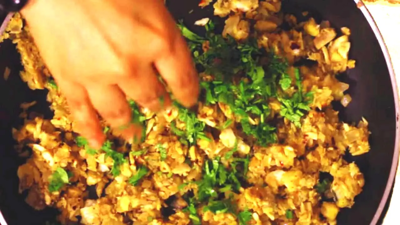 Adding coriander leaves 