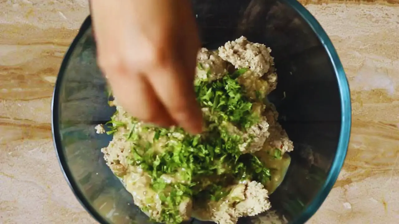 Adding coriander leaves 