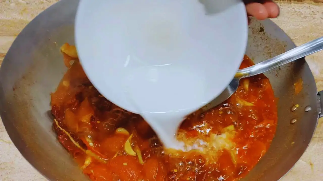 Adding corn flour to Momos Chutney ingredients 