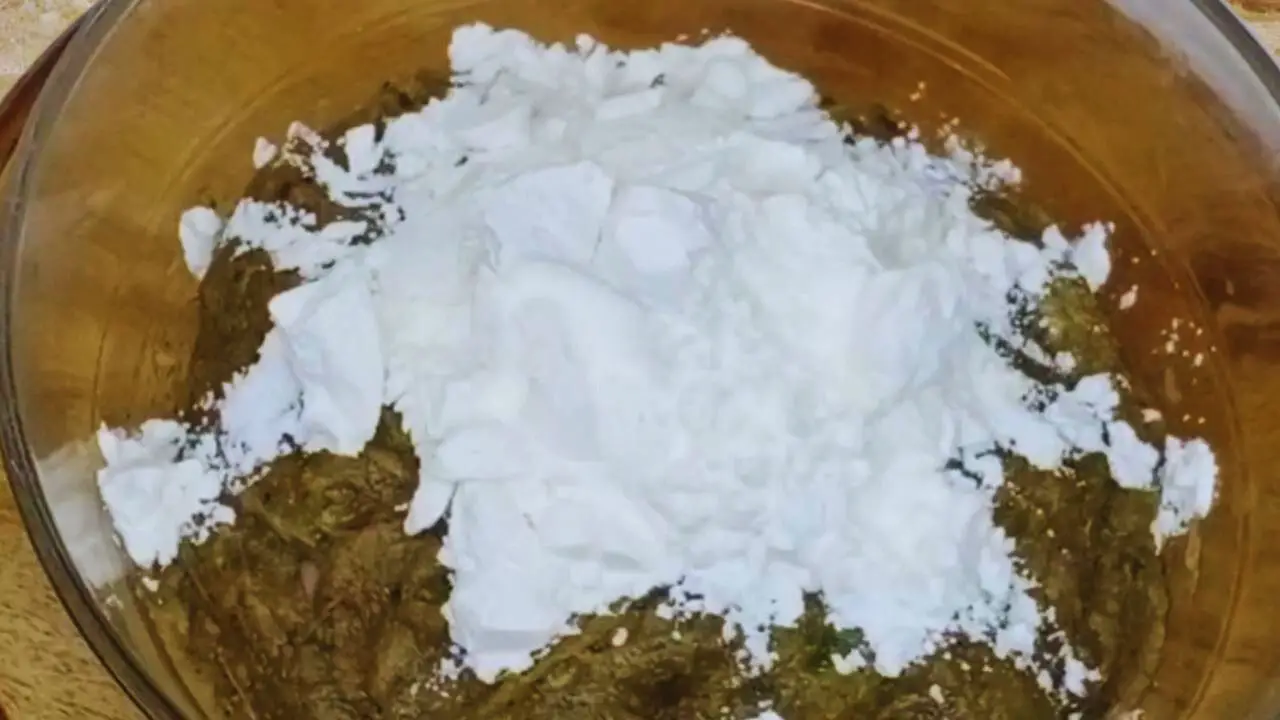 Adding corn flour to mutton lollipop mixture 