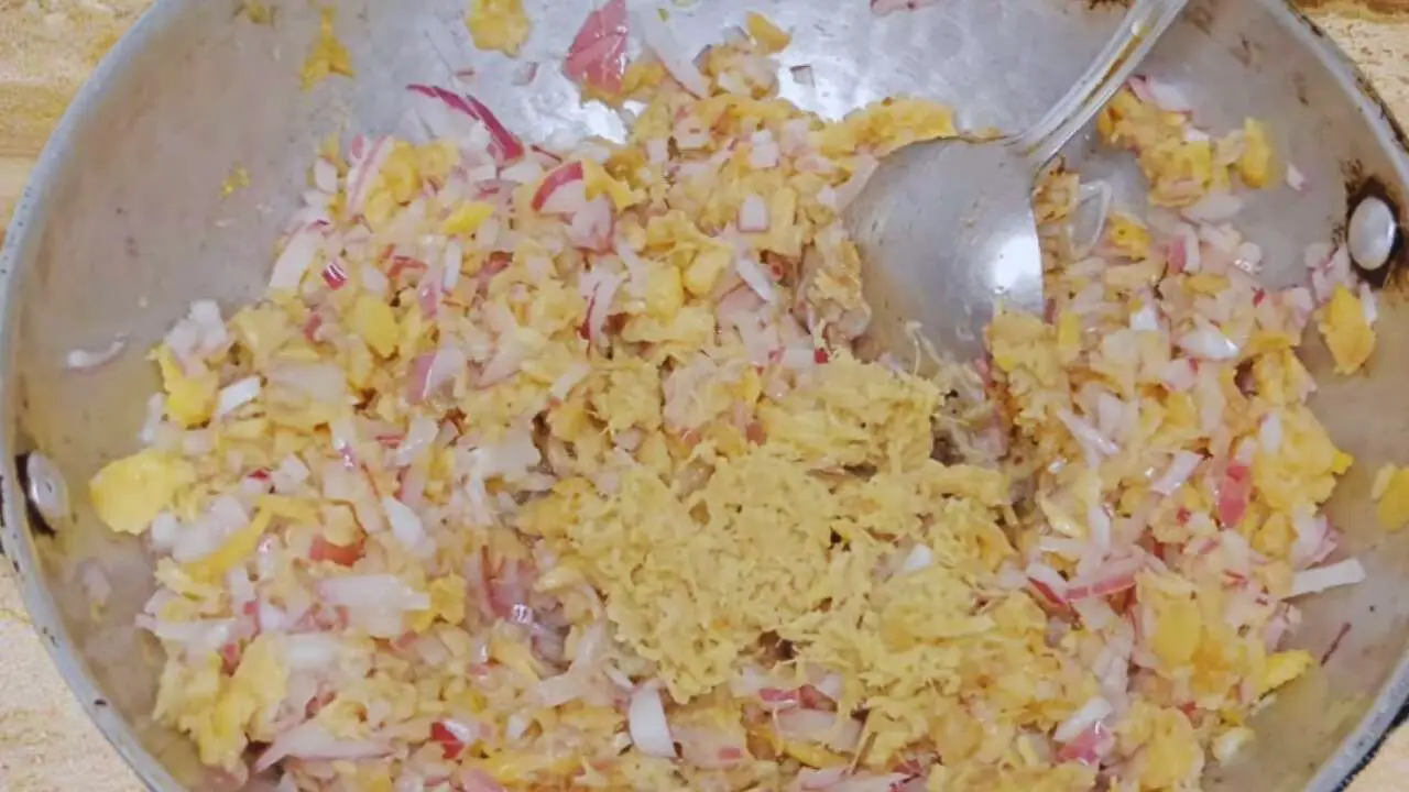 Adding ginger to Fish Momo ingredients 