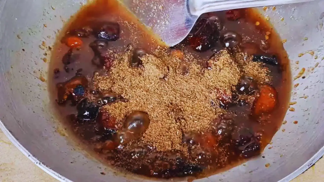 Adding ground spices to Ber Ki Chutney 