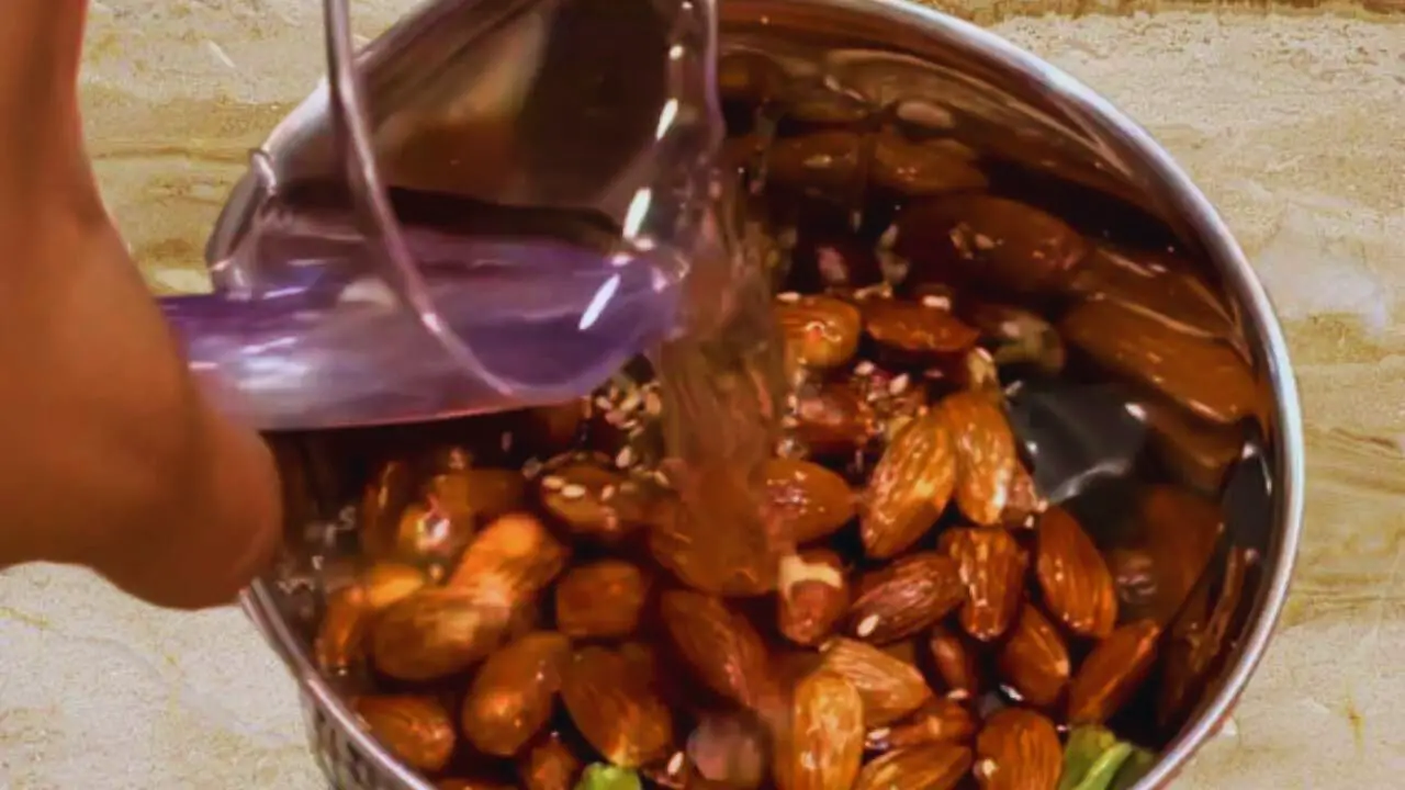 Adding more water to make almond chutney paste 