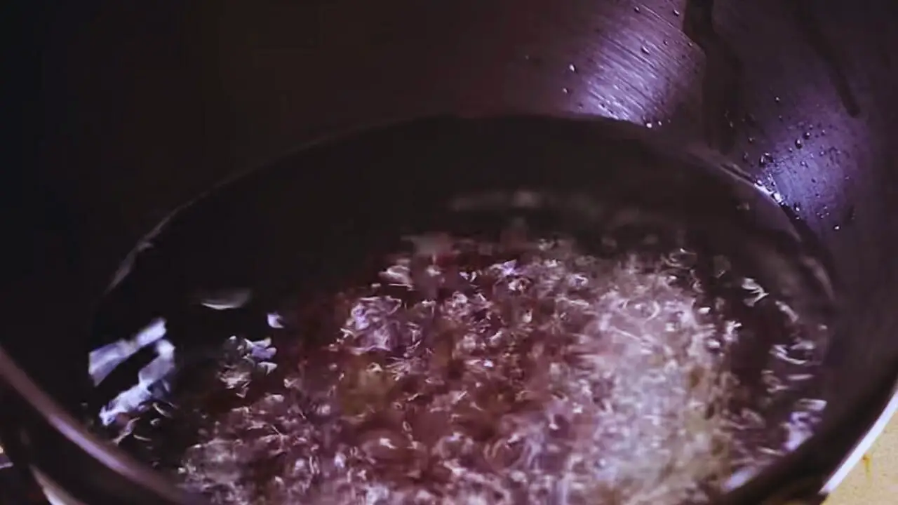 Adding mustard seeds to peanut chutney tadka 