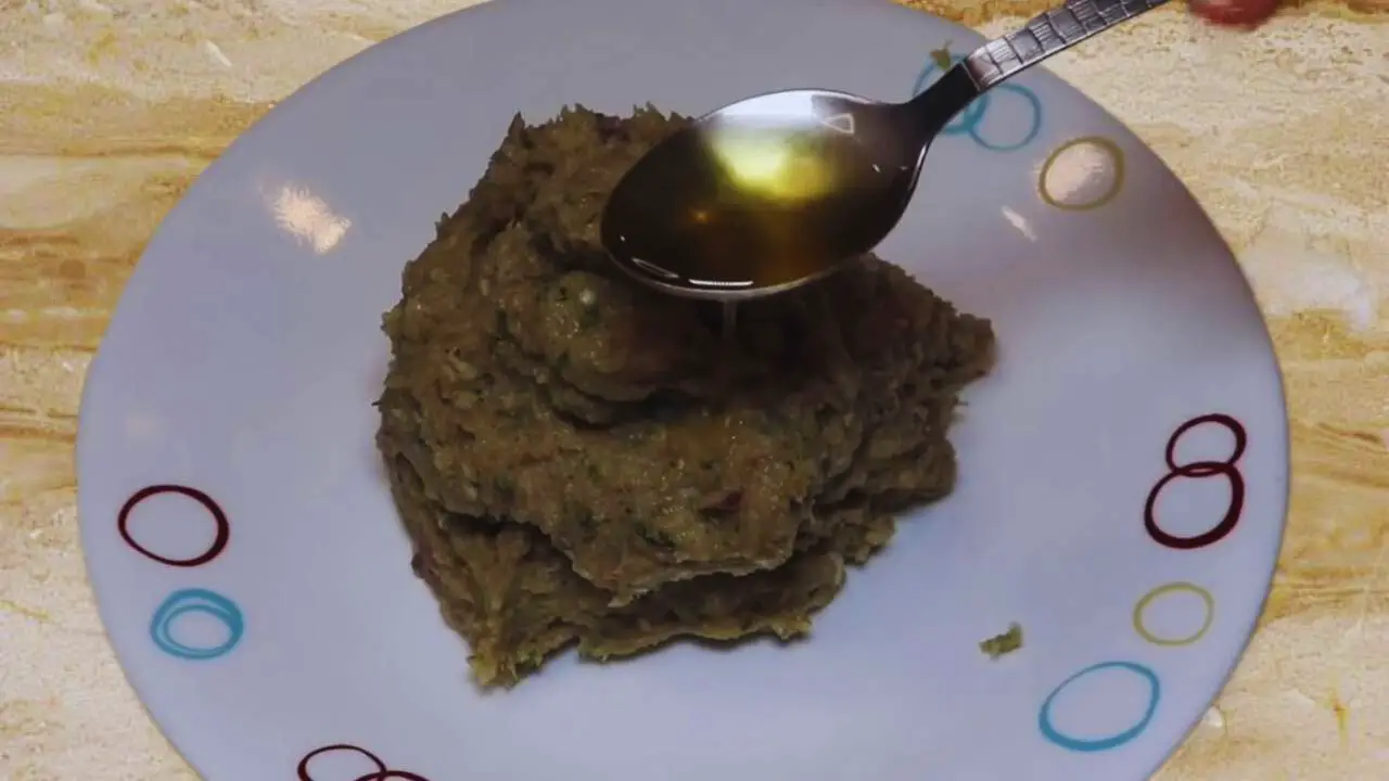 Adding oil to Chicken Cutlet paste
