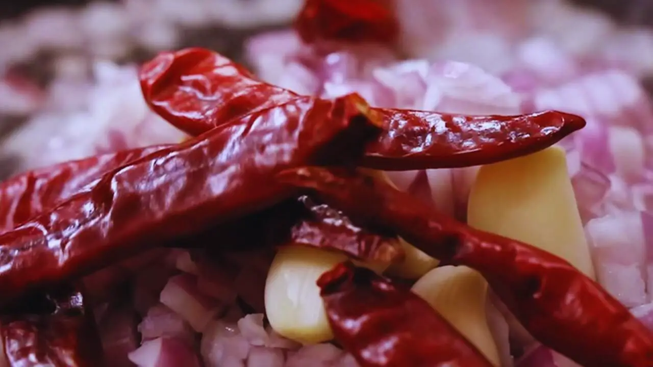 Adding onions and other ingredients for the peanut chutney 
