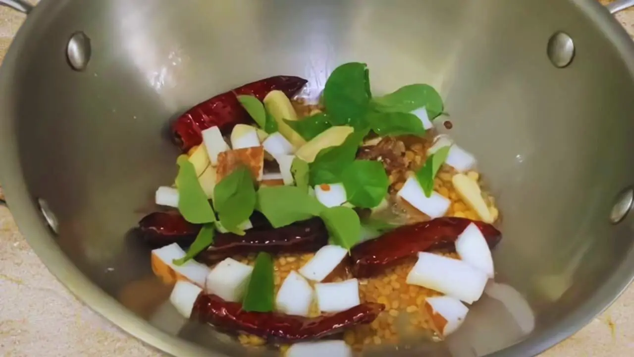 Adding other ingredients to make Chow Chow Chutney