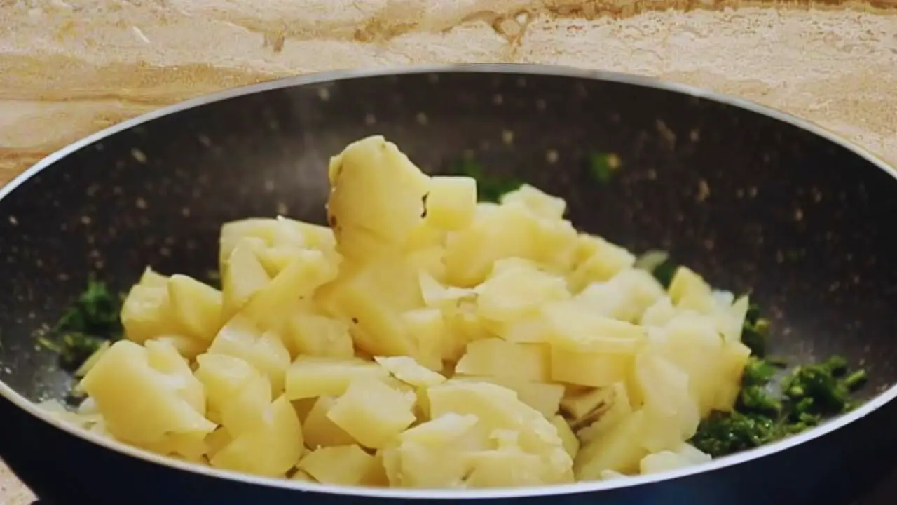 Adding potatoes 