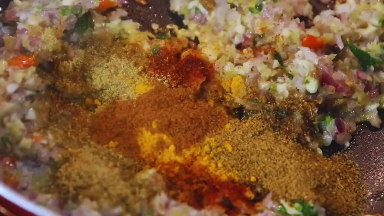 Adding powder spices to Fish Chop ingredients 