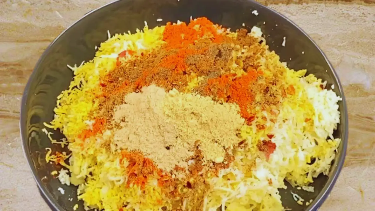 Adding powder spices to make egg kabab 