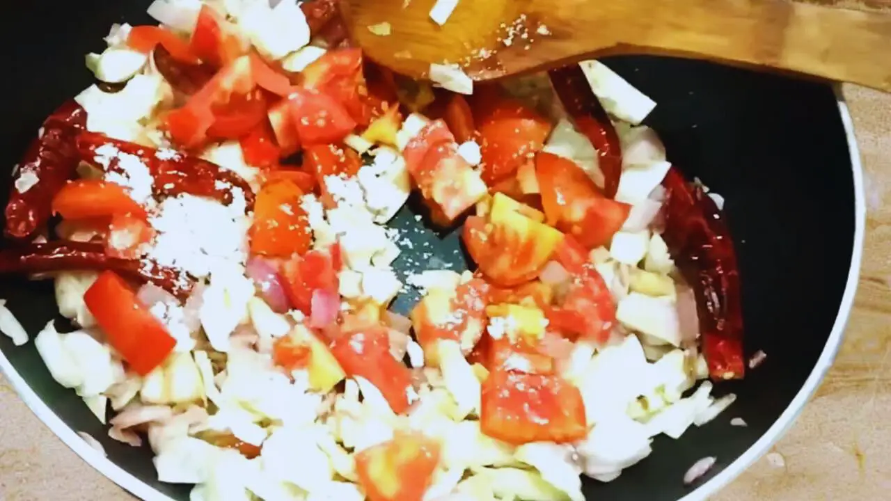 Adding salt to Cabbage Chutney ingredients 