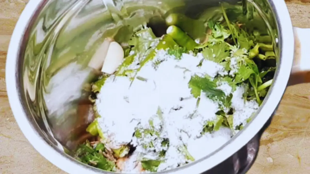 Adding salt to Dahi Chutney ingredients 