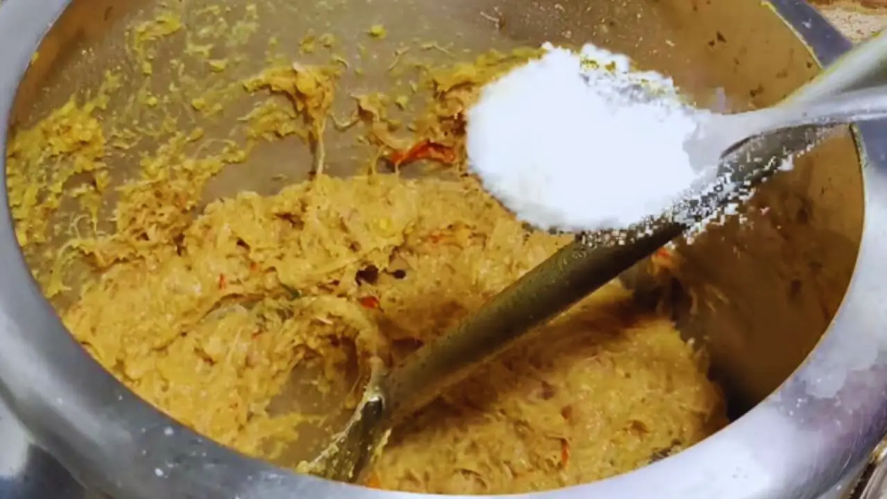 Adding salt to mutton kabab mixture 