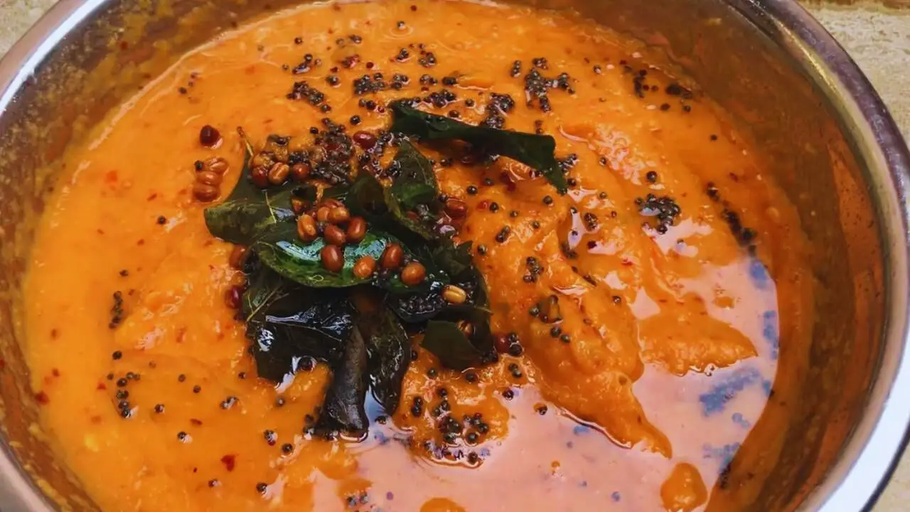 Adding tadka to the Carrot Chutney paste