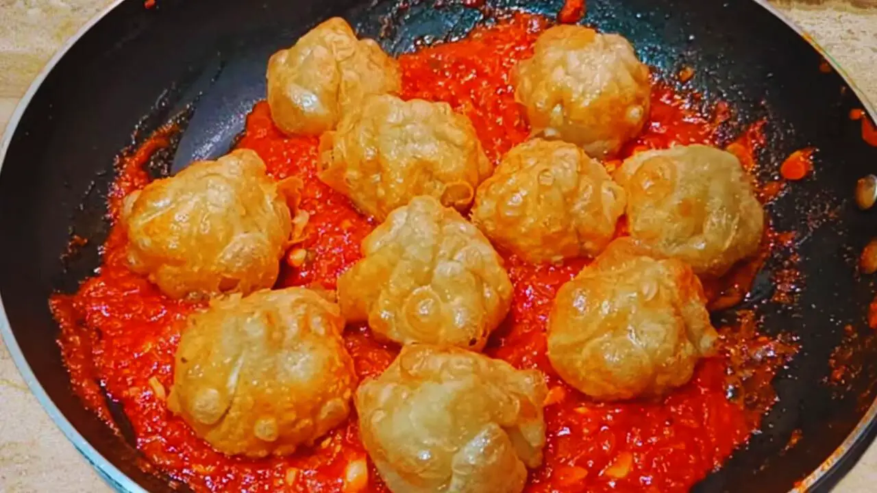 Adding the fried Fish Momos