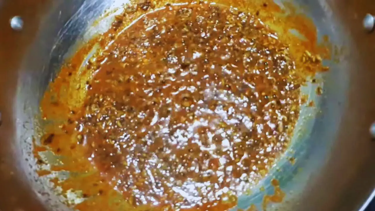 Adding the Karonda Chutney spice mixture 