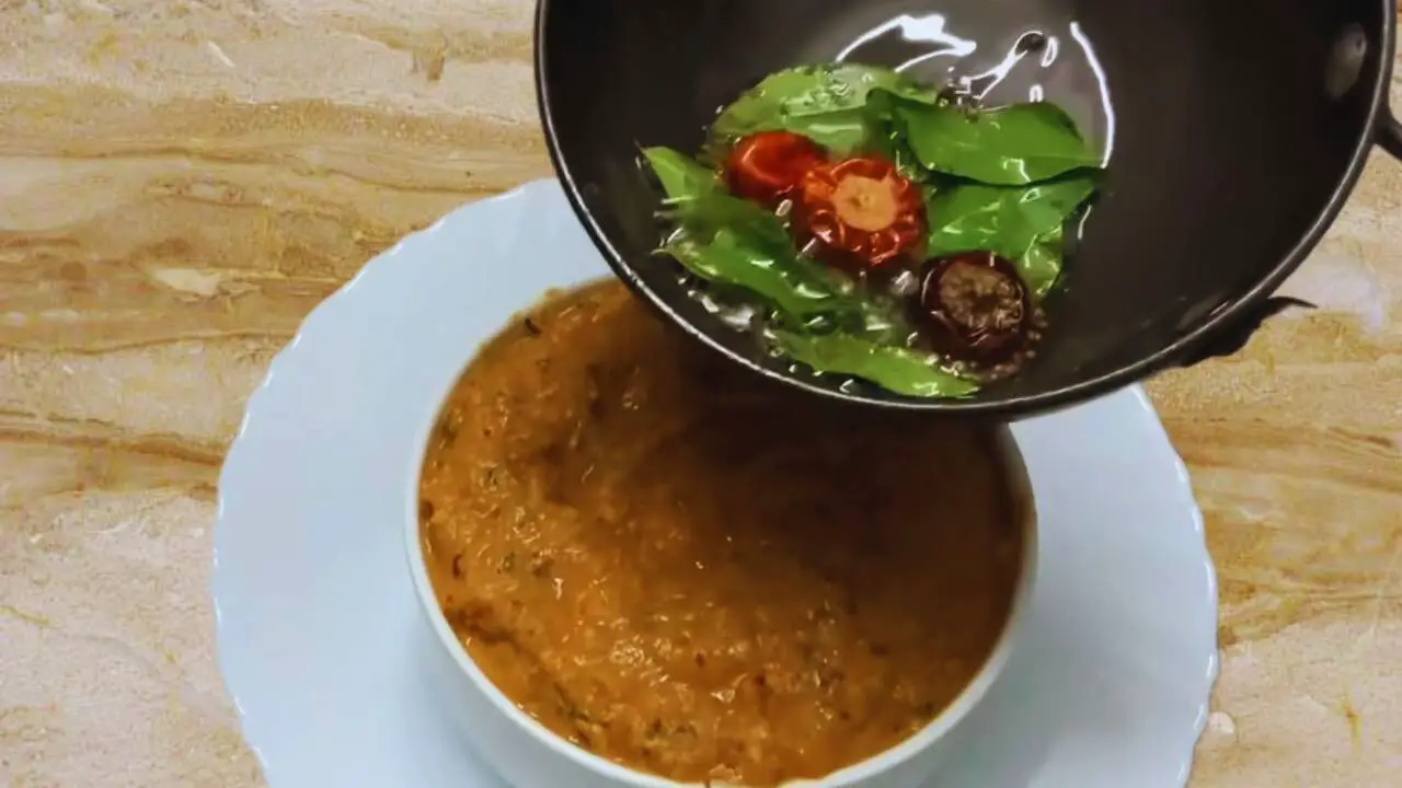 Adding the tadka to Chow Chow Chutney paste