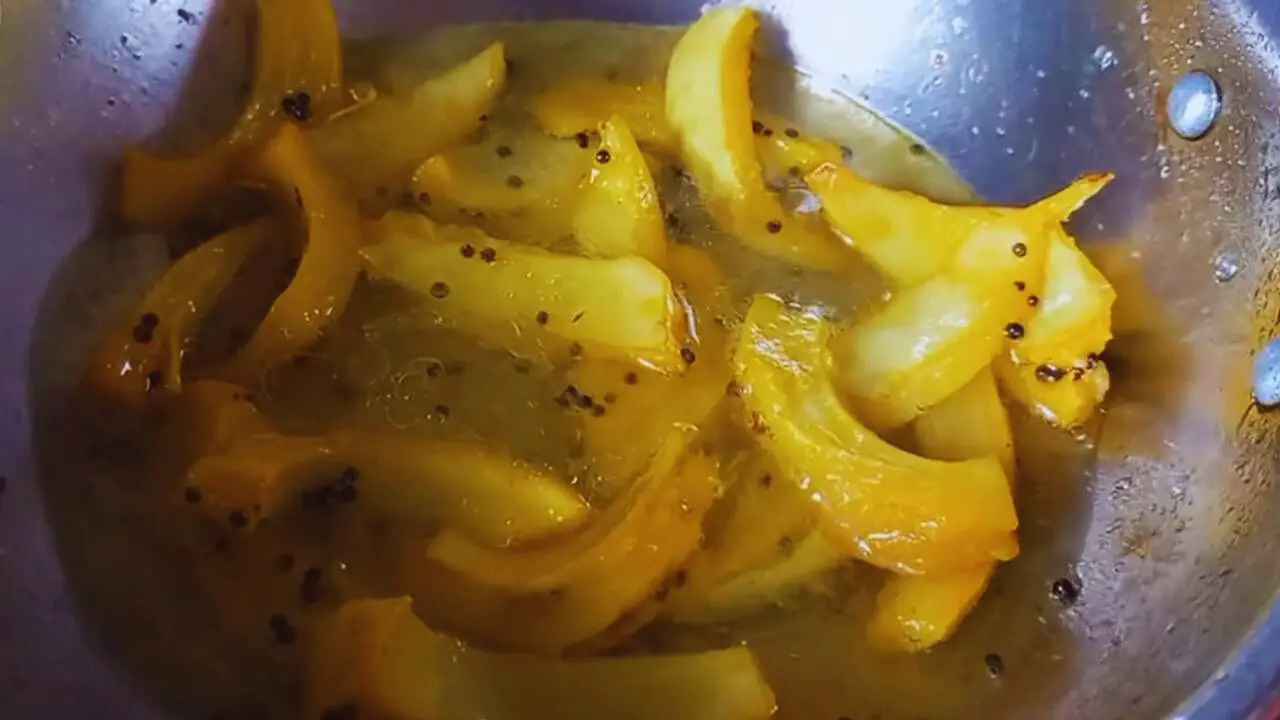 Adding water to make Elephant Apple Chutney 
