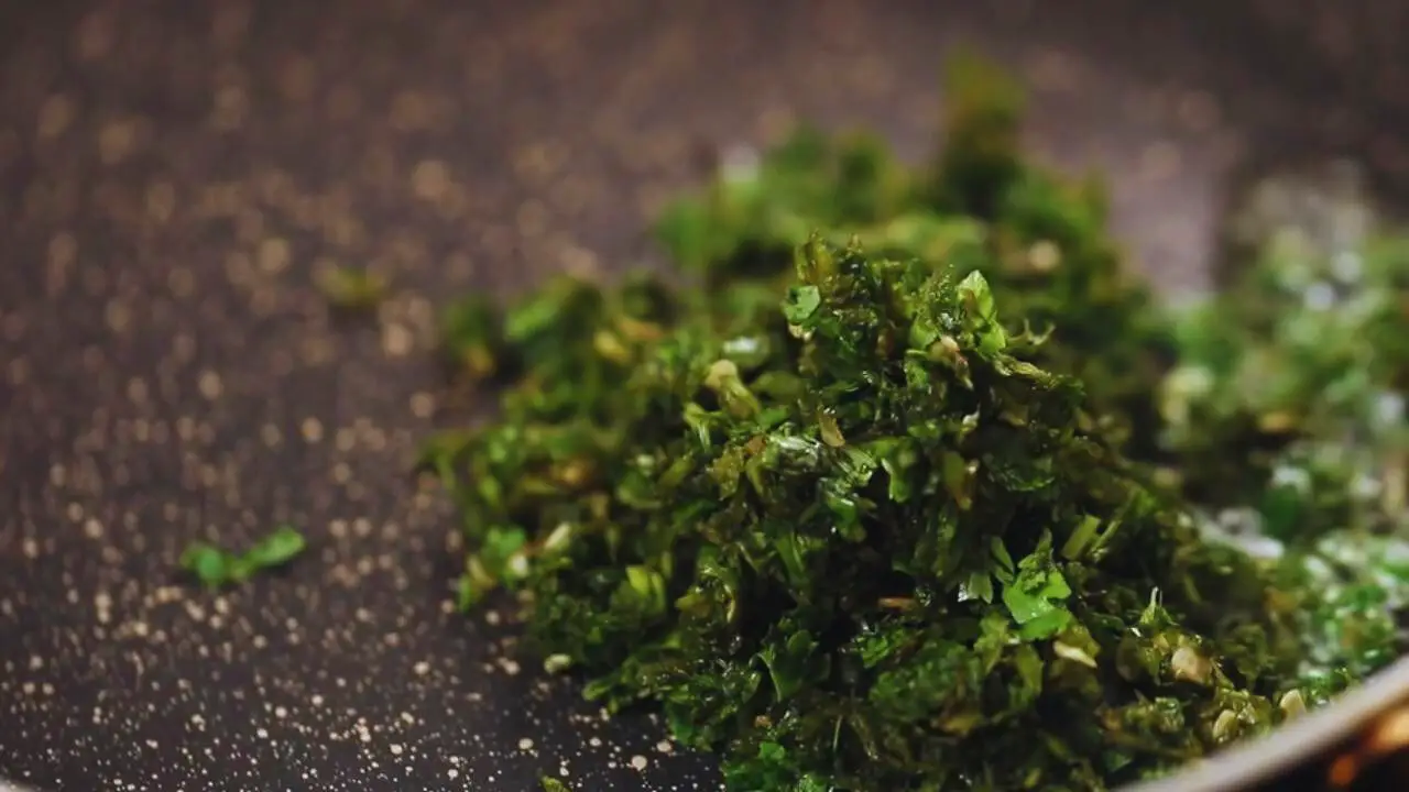 Cooking the ground greens 