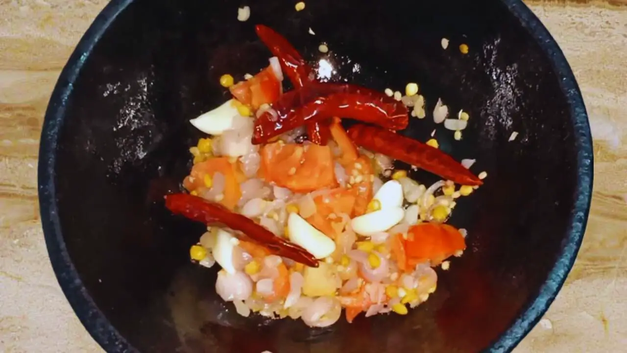 Cooking the ingredients of Mushroom Chutney 