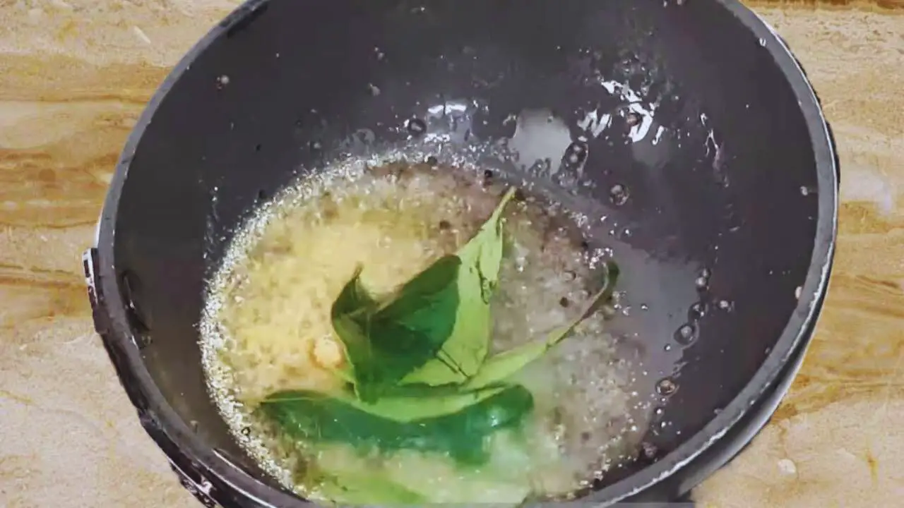 Cooking the tadka for Green Tomato Chutney 