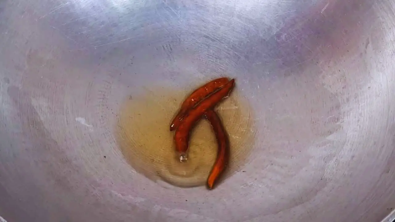 Frying chilies to add to Ber Ki Chutney 