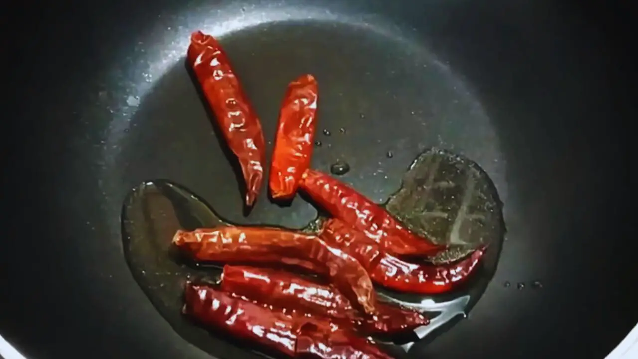 Frying chilies to add to Cabbage Chutney 
