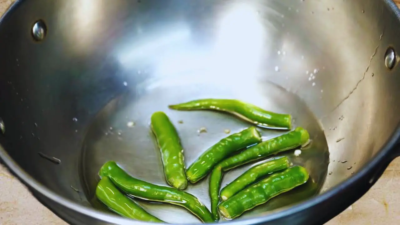 Frying chilies to make Brinjal Chutney 
