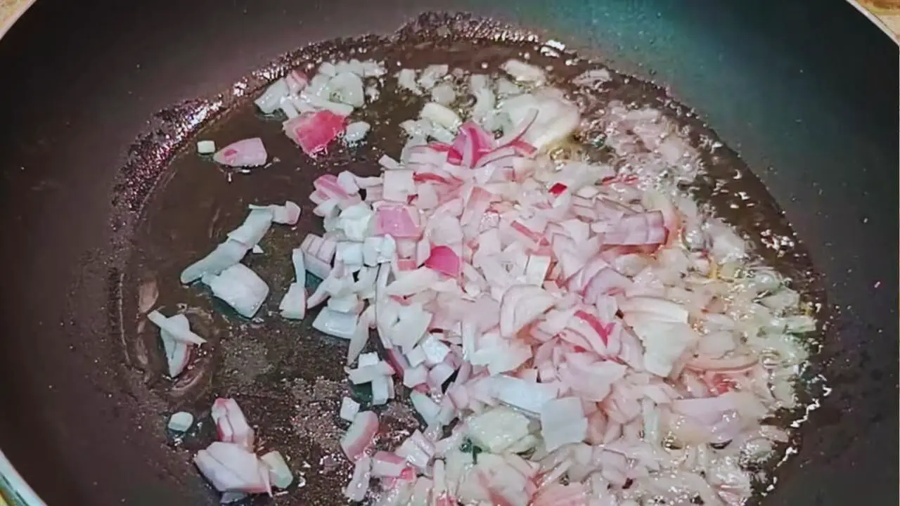 Frying onions to make Fish Momo sauce