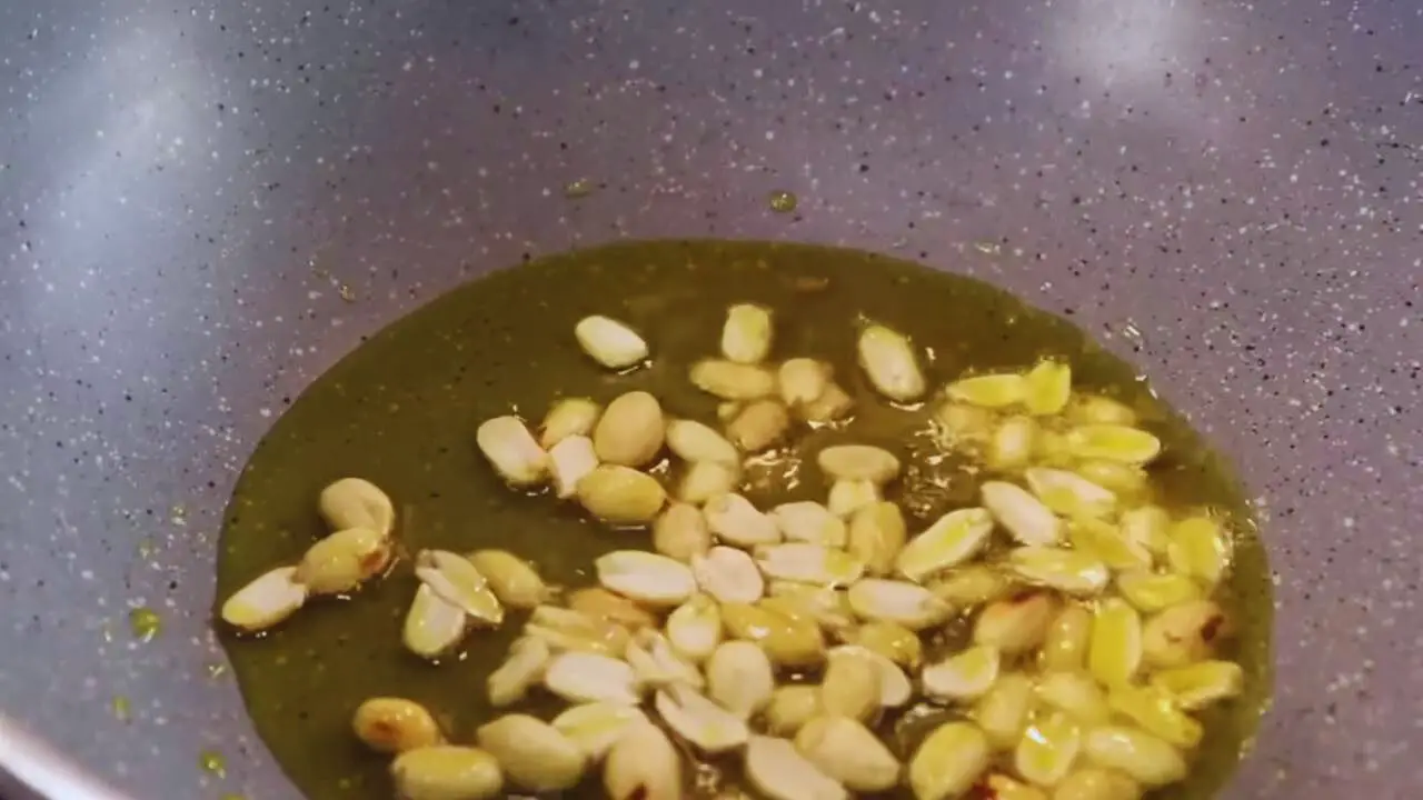 Frying peanuts to make Vegetable Chop