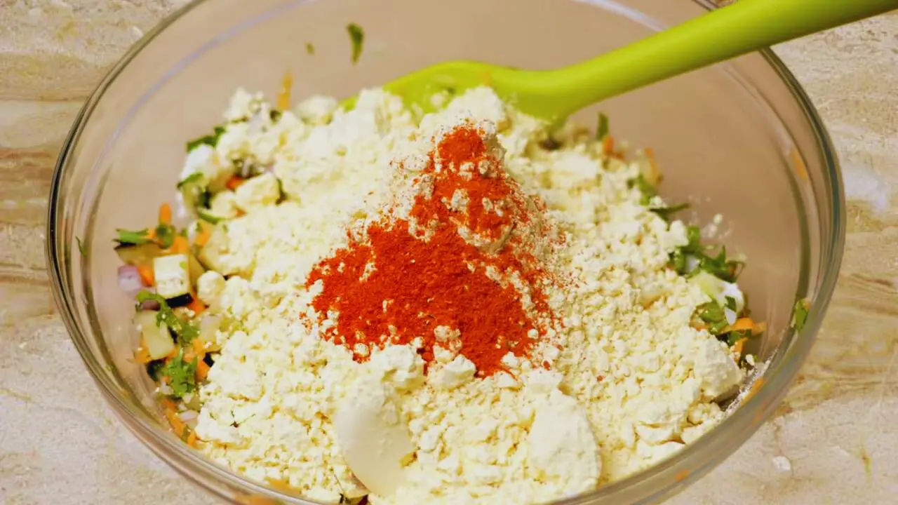 Making the batter to coat Vegetable Pakora