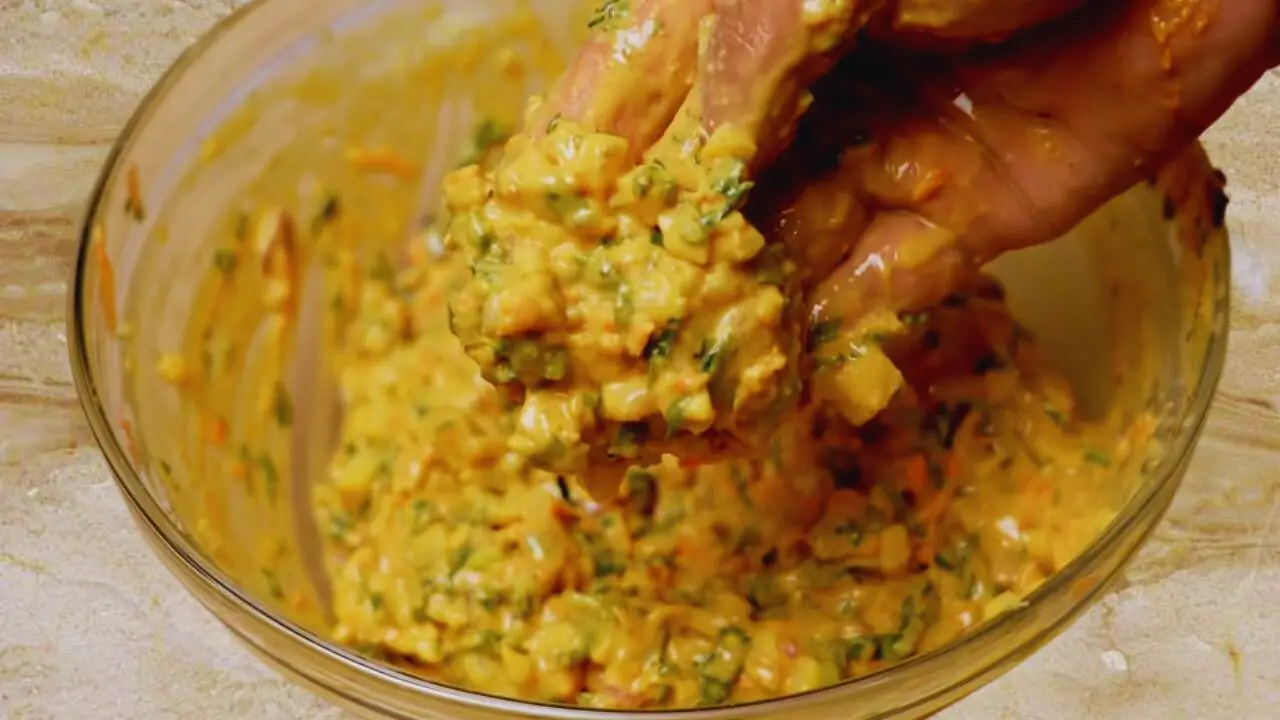 Mixing the ingredients of Vegetable Pakora 