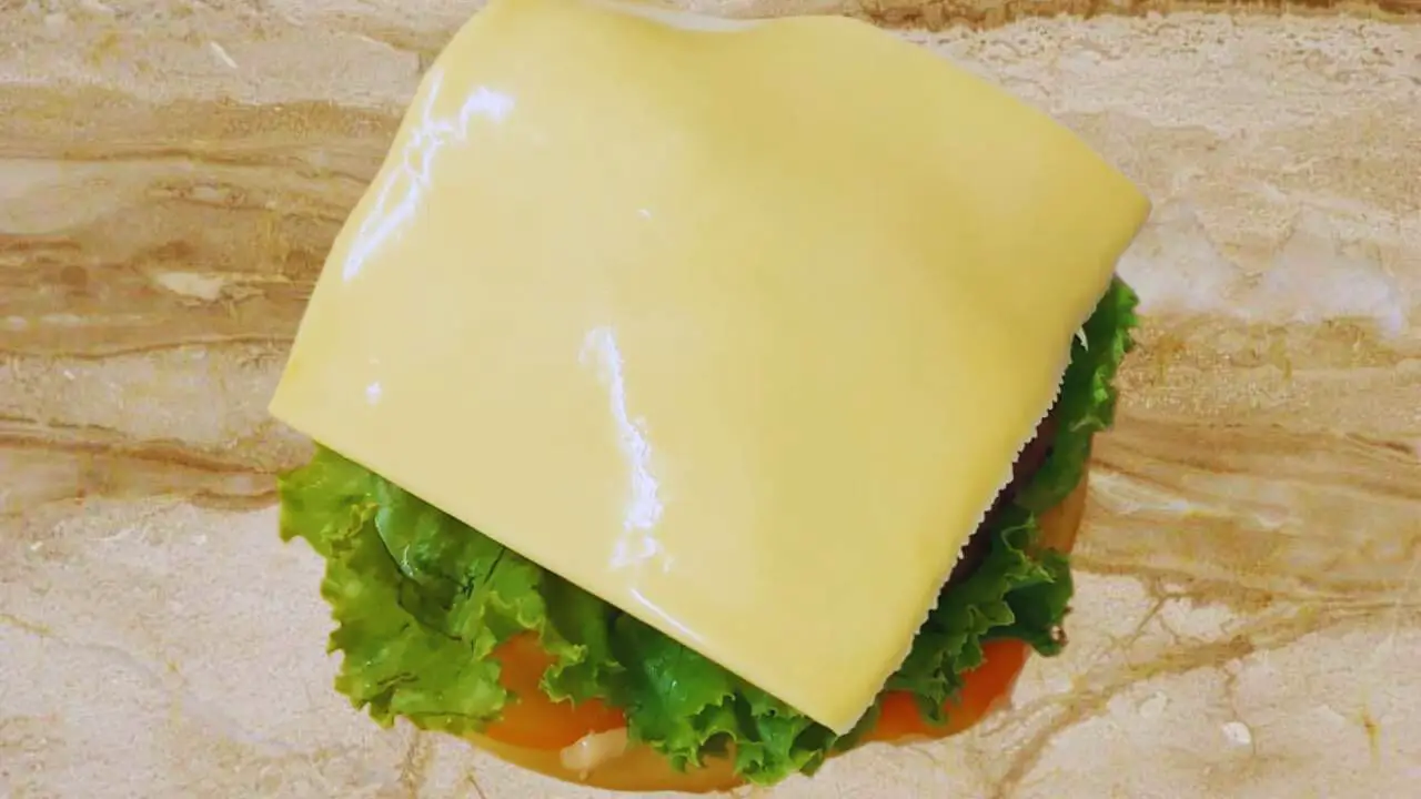 Placing cheese slice 