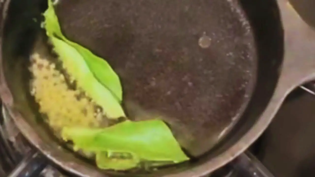 Preparing the tadka for almond chutney 