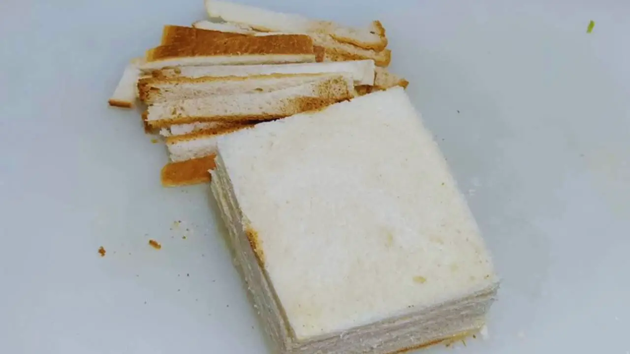 Removing edges of bread slices 