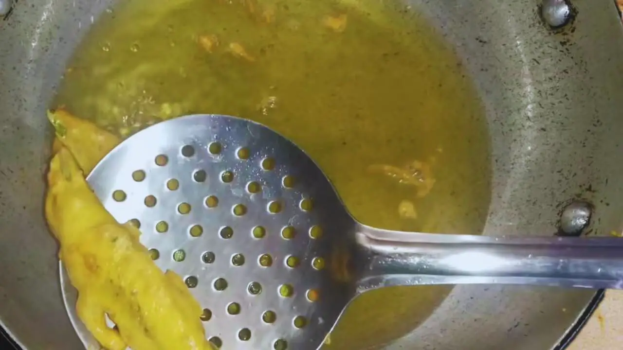 Removing fried Chili Pakoras