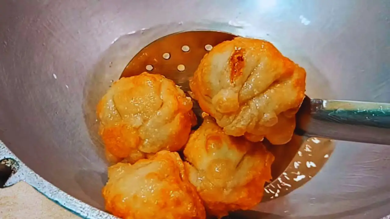 Removing fried Fish Momo