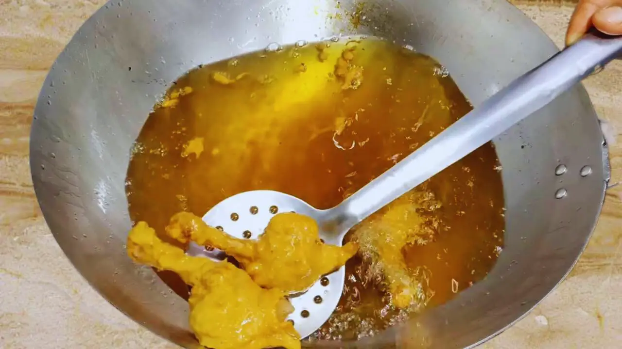 Removing half fried chicken lollipop