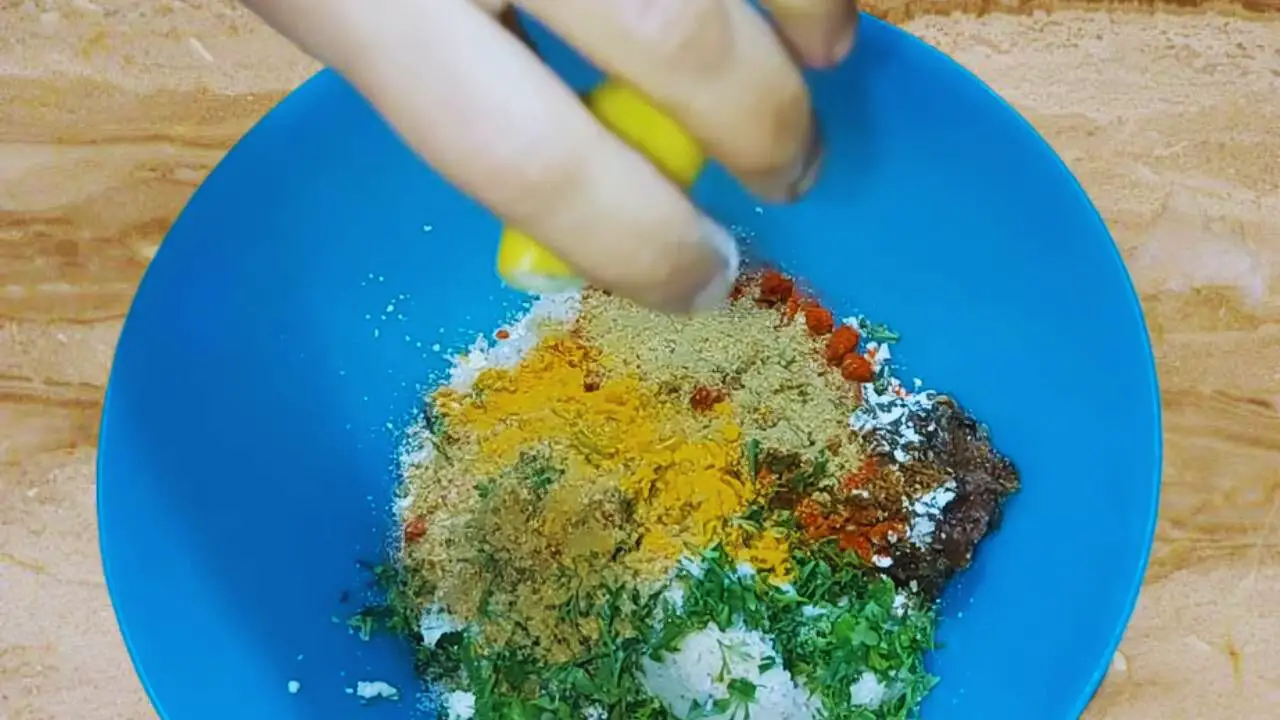Spices and lemon juice added to paneer kabab mixture 