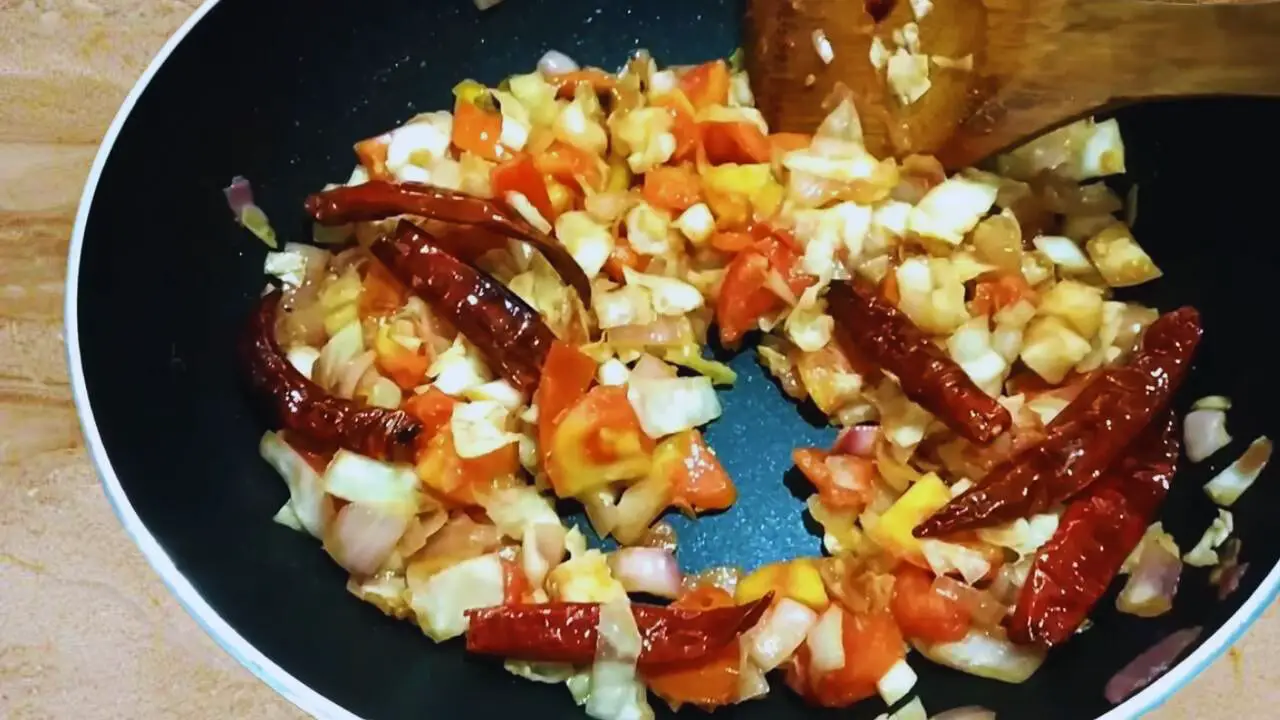 Stirring Cabbage Chutney ingredients 