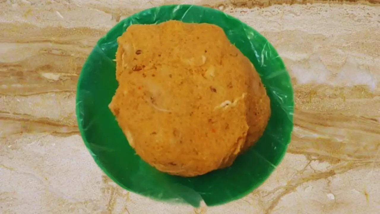 Taking a bit of mutton burger mixture 