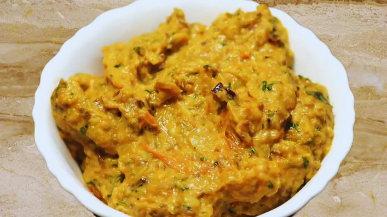 Transferring Brinjal Chutney paste to a bowl 