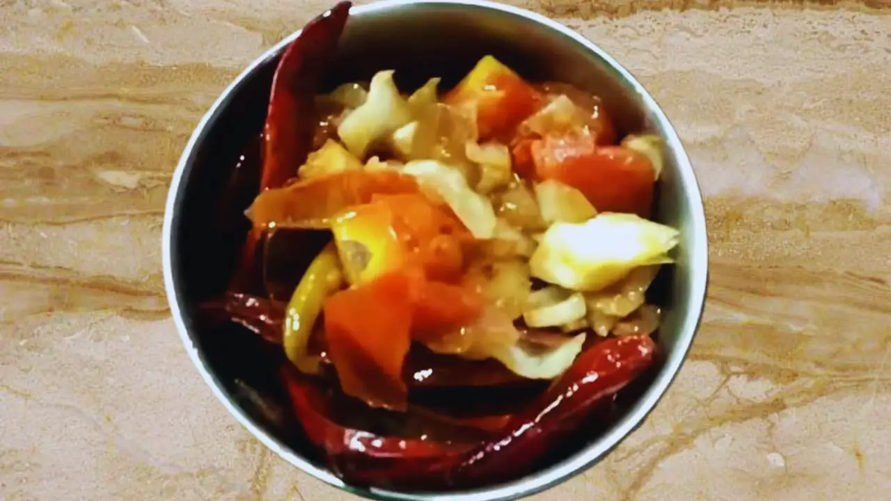 Transferring Cabbage Chutney ingredients to a grinder 
