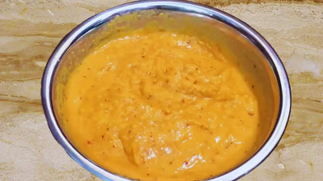 Transferring Carrot Chutney paste to a bowl