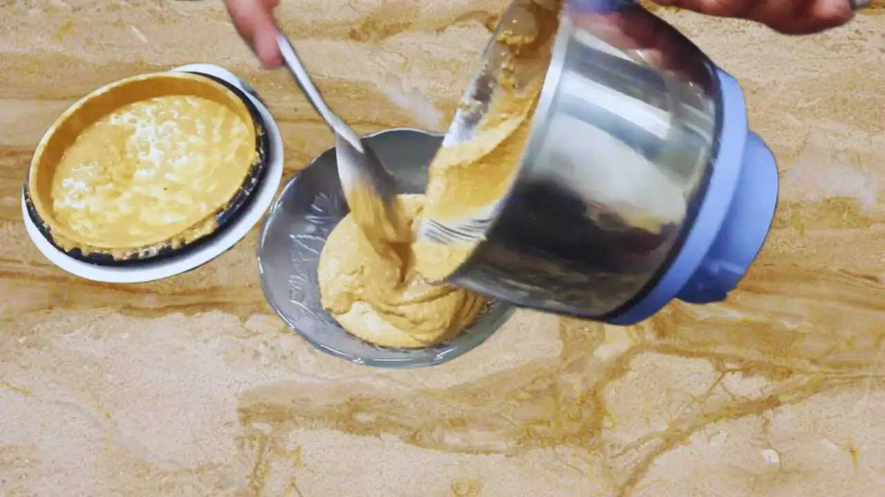 Transferring poppy seeds paste to a bowl 