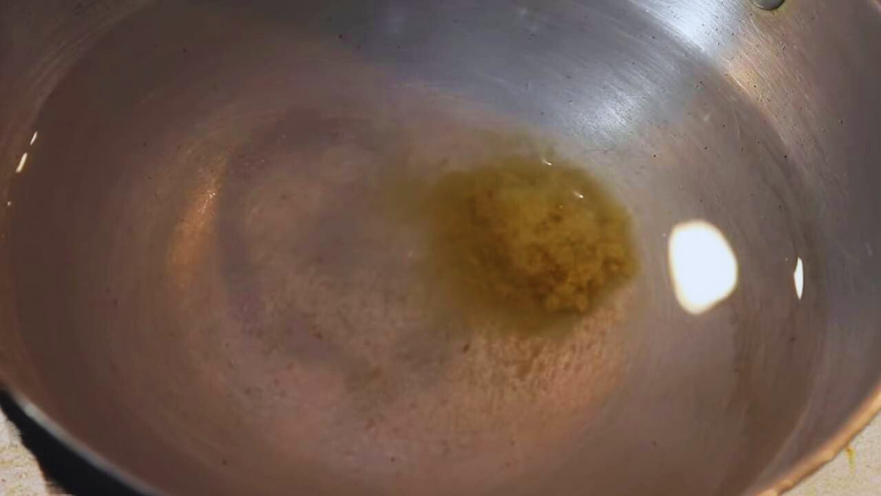 Water with salt and ginger garlic paste to boil fish 